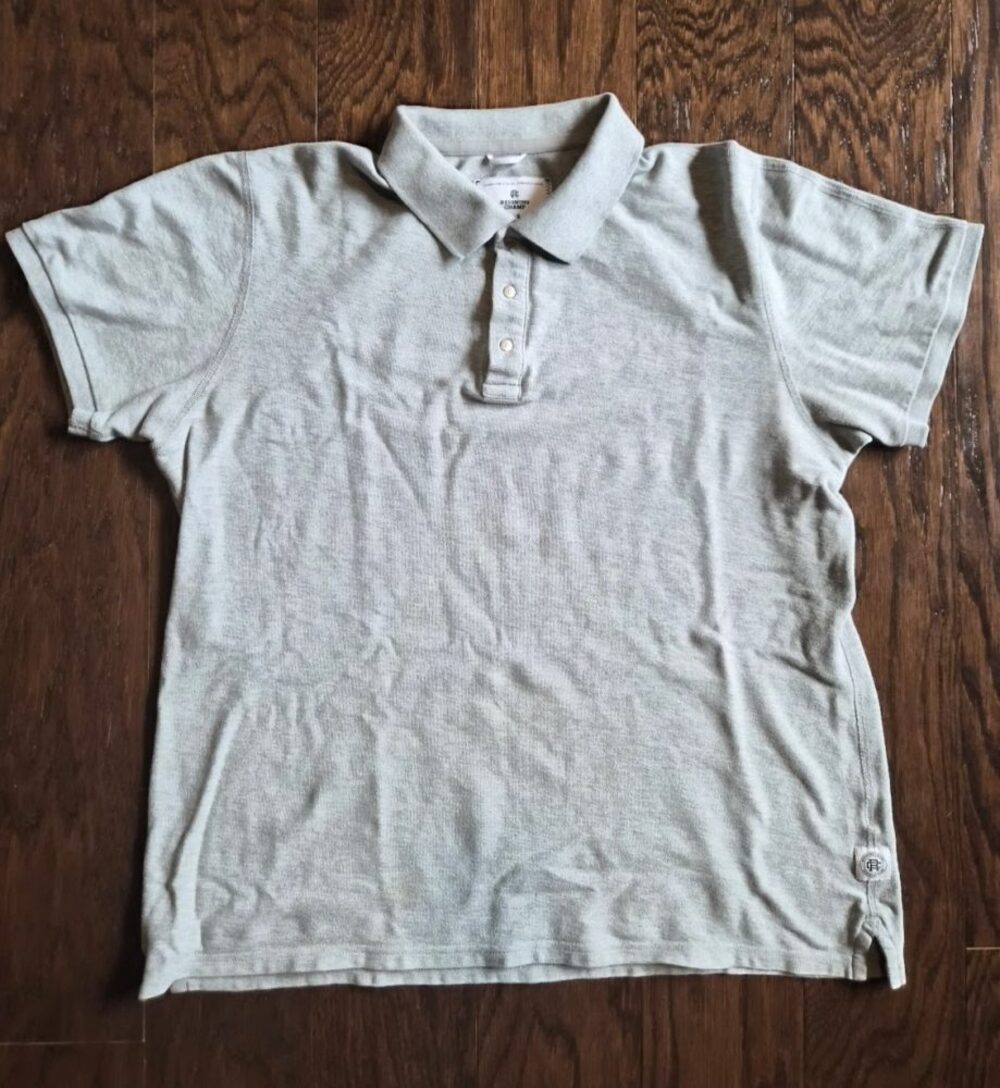 REIGNING CHAMP MEN'S ATHLETIC PIQUE SNAP POLO SHIRTITEM OVERVIEWBrand: Reigning